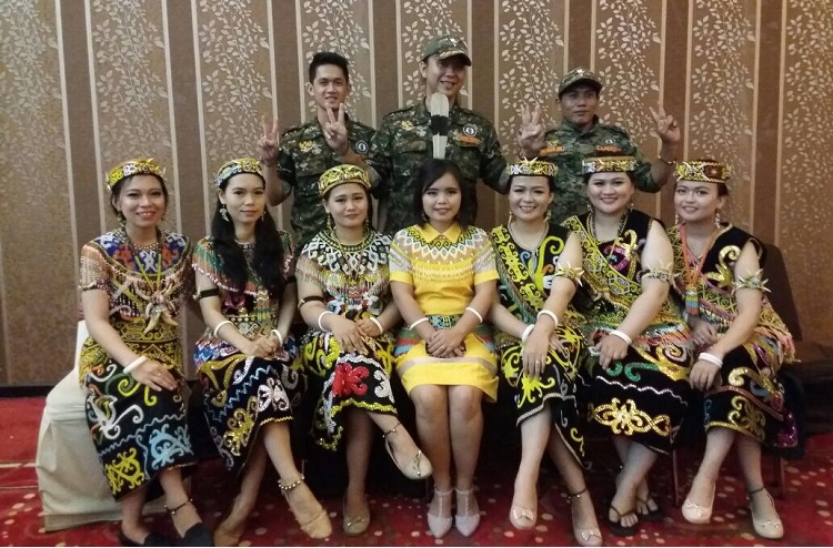Berani meets femininity: LPDAKT members, with the women wearing traditional Dayak outfits / Hamsa, LPDAKT